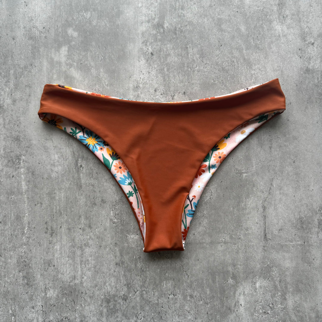 Braguita gaviotas flores durazno print reversible a tierra