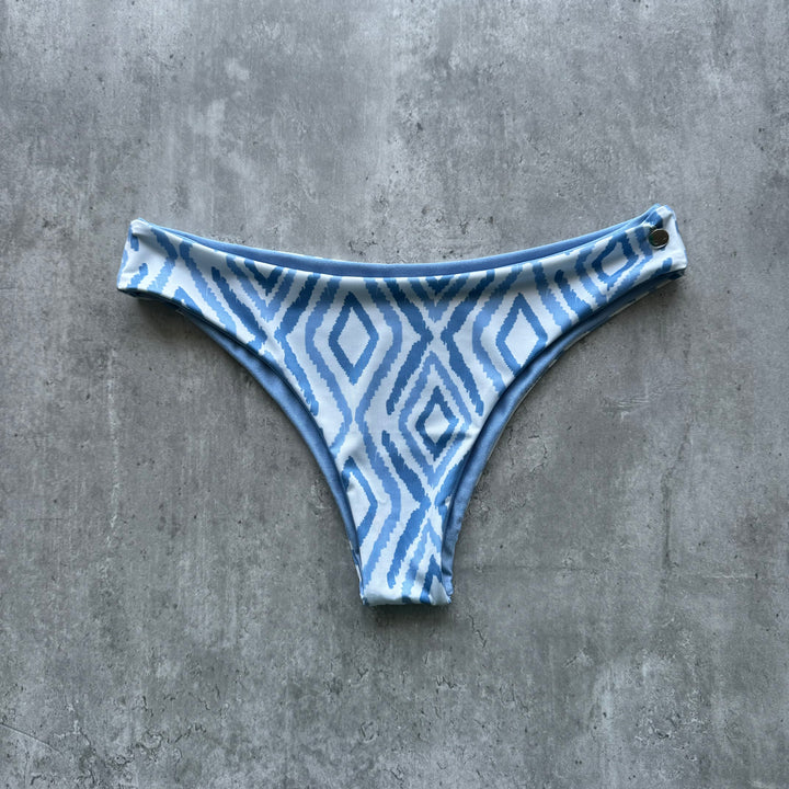 Braguita gaviotas celeste print reversible a celeste satinado