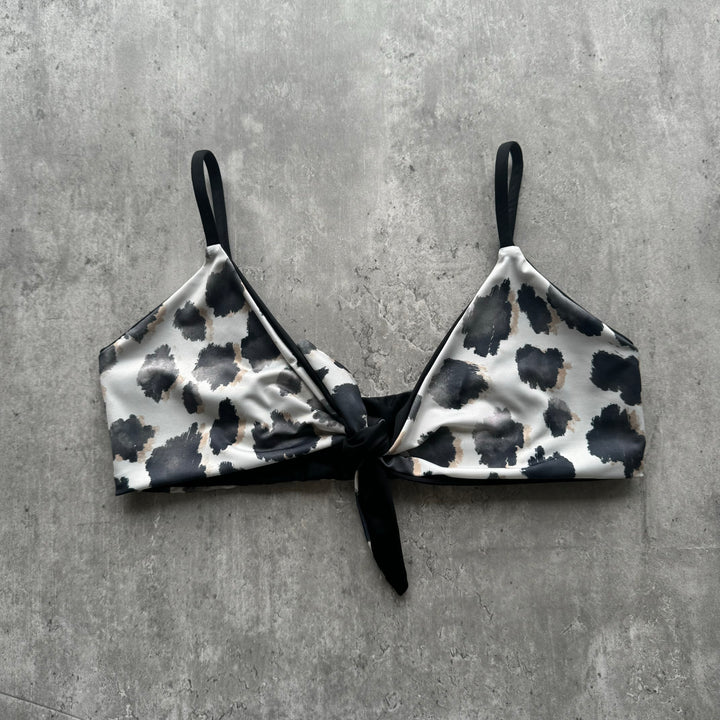 Top Santa María animal print reversible a negro